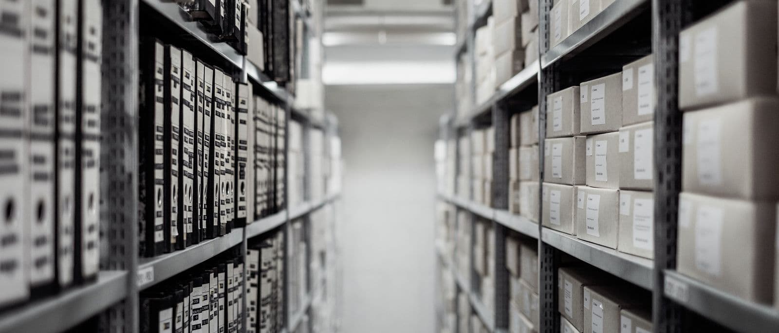 Aisle of shelved document archive boxes