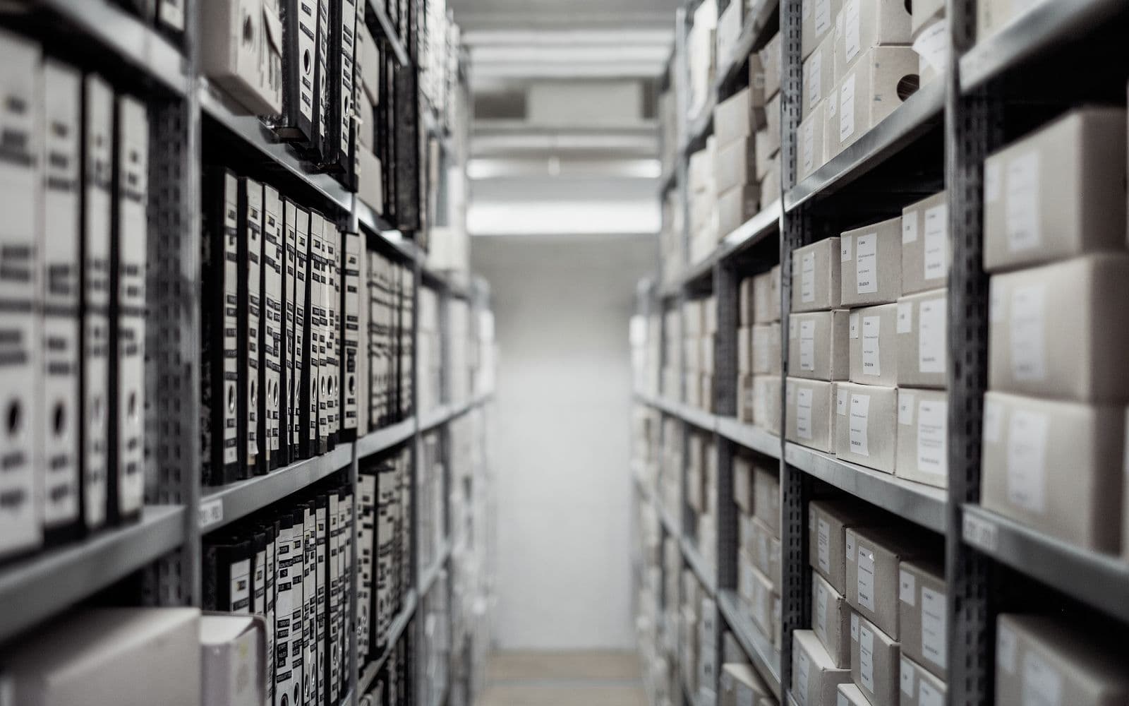 Aisle of shelved document archive boxes